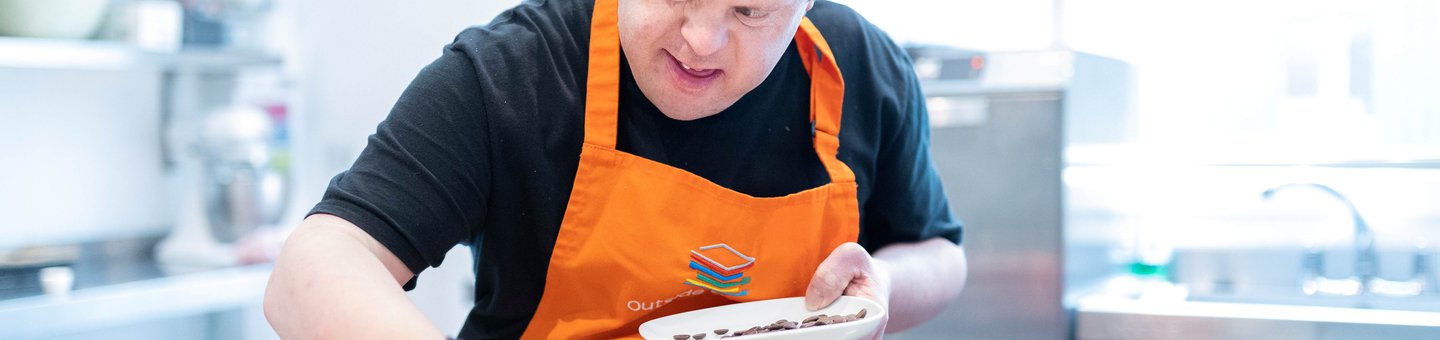 Trainee working at Outside the box, a cafe served by individuals with learning disabilities