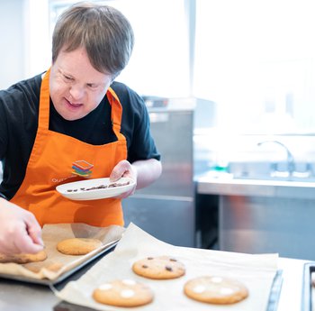 Trainee working at Outside the box, a cafe served by individuals with learning disabilities