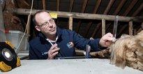 Man measuring with ruler