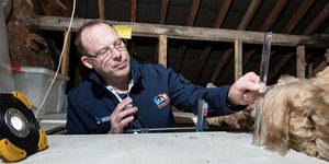 Man measuring with ruler