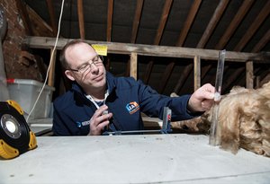 Man measuring with ruler