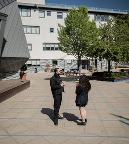 AllChild Link worker and student walking 