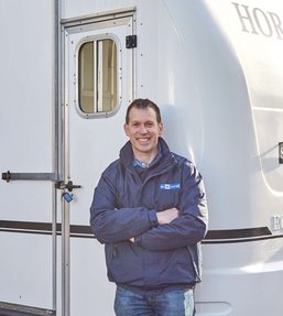 Man standing infront of a trailer