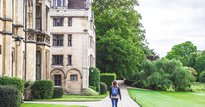 Woman walking past a University
