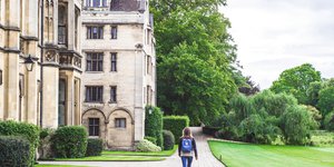 Woman walking past a University