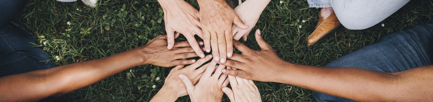 Diverse group of hands in circle