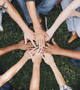 Diverse group of hands in circle