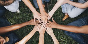 Diverse group of hands in circle