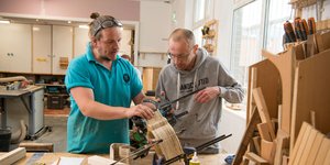 Two men woodworking