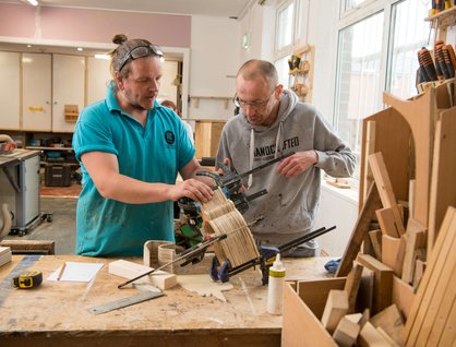Two men woodworking