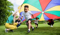 boy running with kite
