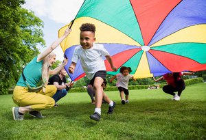 boy running with kite