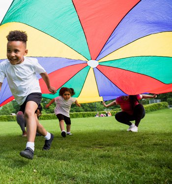 boy running with kite