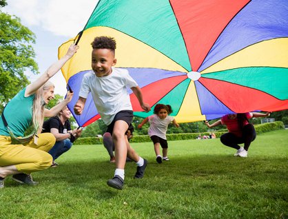 boy running with kite