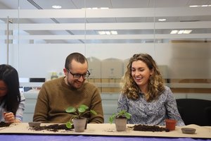 BSC Staff members participating in a repotting workshop by the glasshouse