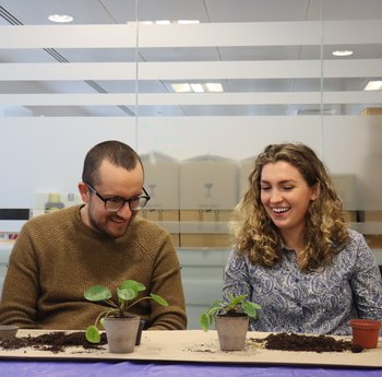 BSC Staff members participating in a repotting workshop by the glasshouse