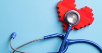 Image showing a stethoscope listening in to a heart which is made of Lego bricks