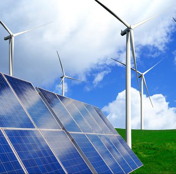 Solar panels and wind turbines on a field