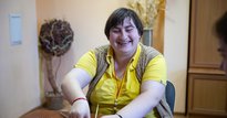 Woman smiling and doing crafts