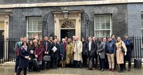 Group of people from social investment sector standing outside 10 Downing Street