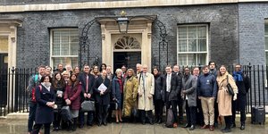 Group of people from social investment sector standing outside 10 Downing Street