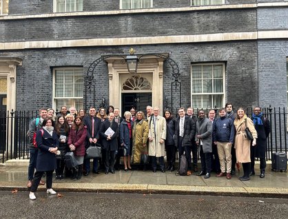 Group of people from social investment sector standing outside 10 Downing Street