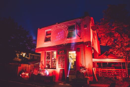 Outside of a pub with lights