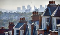 View of some terraced houses with the City of London in the background