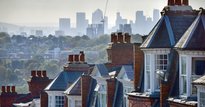 View of some terraced houses with the City of London in the background