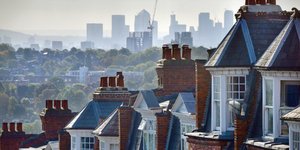View of some terraced houses with the City of London in the background