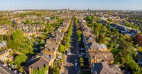 Image of a UK residential street with lots of trees taken from above