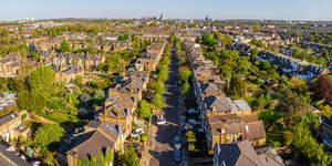 Image of a UK residential street with lots of trees taken from above