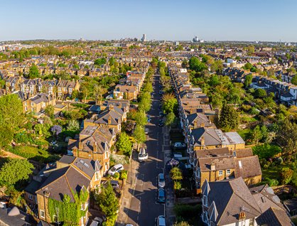 Image of a UK residential street with lots of trees taken from above