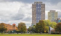 Image of high rise flats next to a park